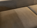 Couch in the middle of being cleaned